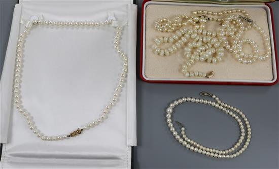 Four assorted single strand cultured pearl necklaces.